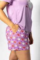 Woman wearing the Rest Day PJ But First Coffee lilac pyjama set, side view