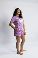 Woman wearing the Rest Day PJ But First Coffee lilac pyjama set, full set on model