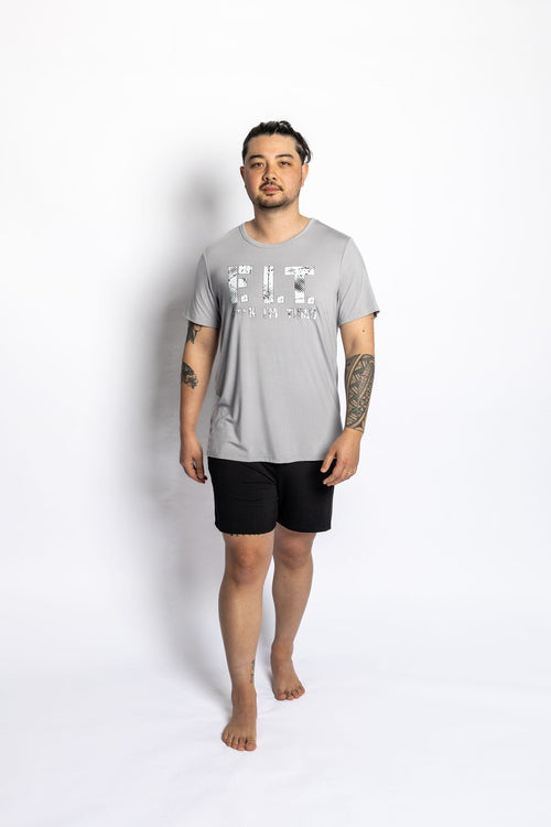 Man wearing the Rest Day PJ F.I.T. grey pyjama t-shirt and shorts set, front view