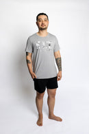 Man wearing the Rest Day PJ F.I.T. grey pyjama t-shirt and shorts set, front view. 